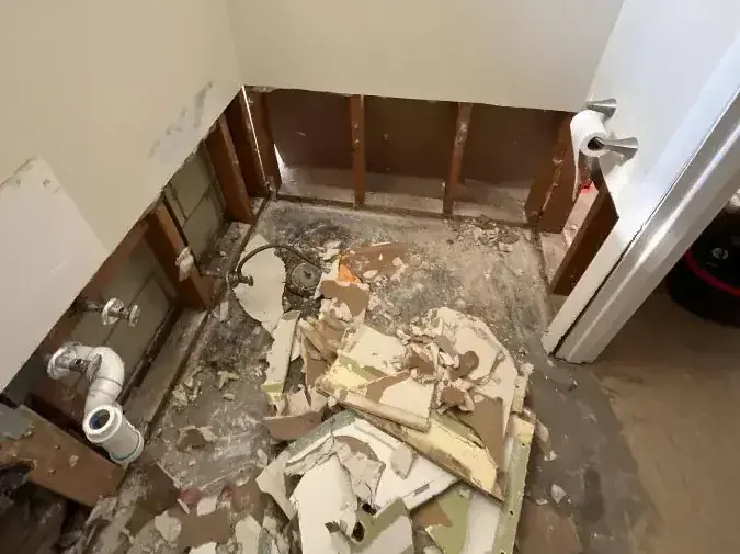 A bathroom taken down to bare studs after a sewage cleanup