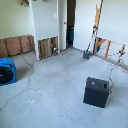 Crew pumping river water out of a flooded lower level