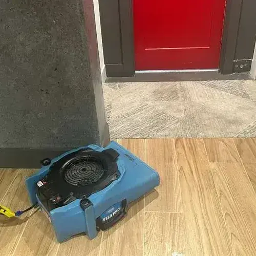 Air mover drying a wood-look tile floor, used on Tualatin jobs